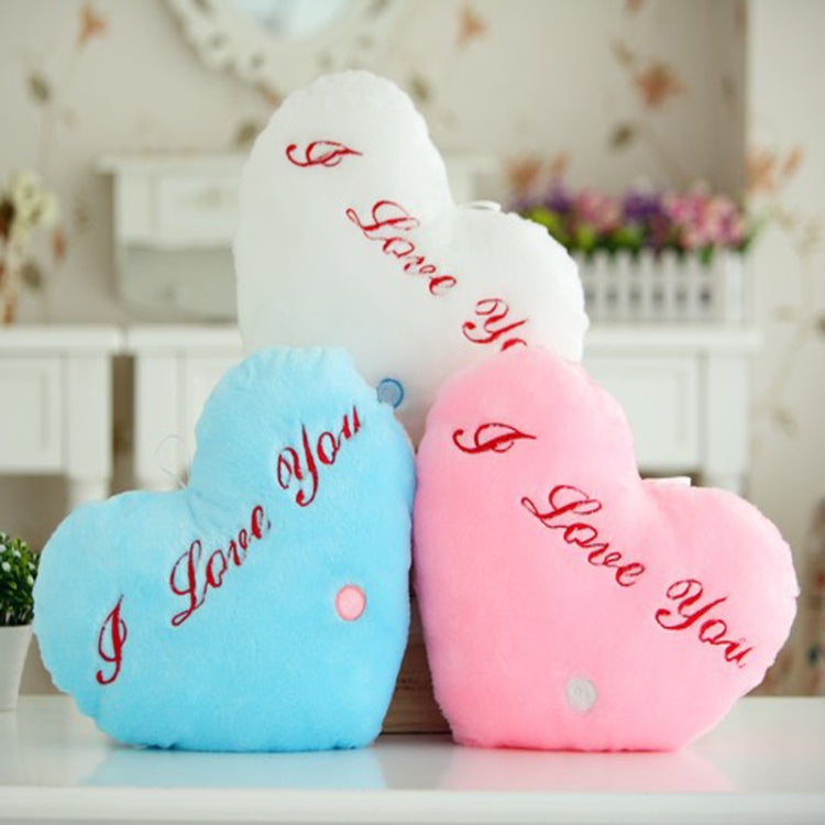 Heart-shaped plush glow pillows in white, blue, and pink with red 'I love You' text