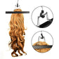 Pink dust-proof hair extension storage bag on metal hanger with hair extensions inside
