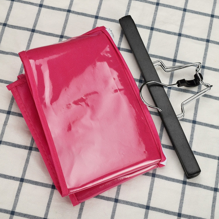Folded pink dust-proof storage bag with clear panel and black hanger clips