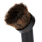 Vacuum cleaner brush head with dense horse-hair bristles on black elbow connector