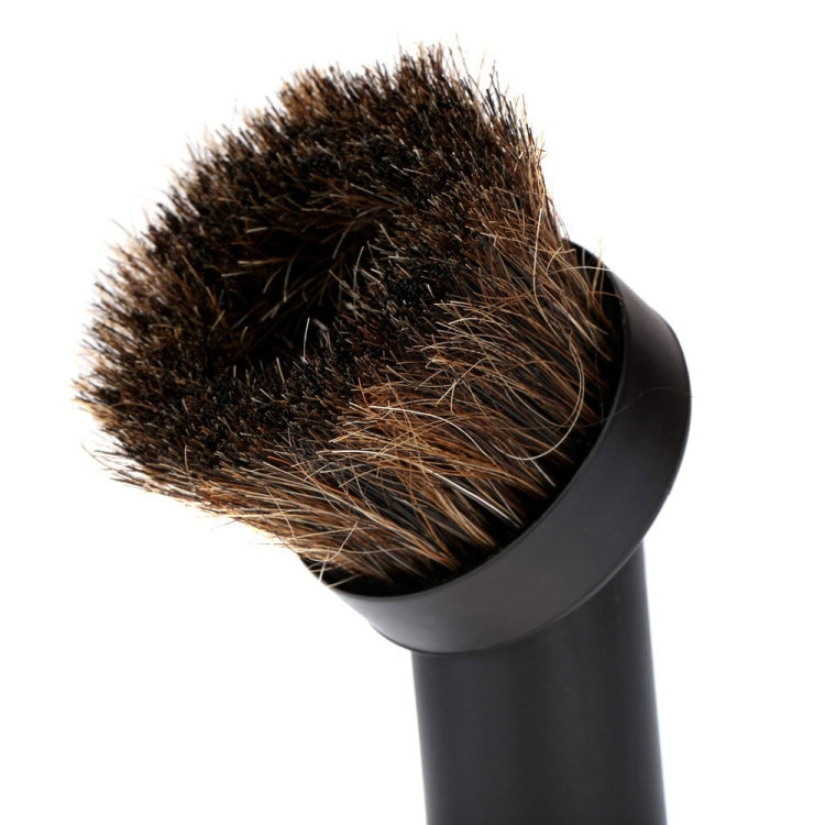 Vacuum cleaner brush head with dense horse-hair bristles on black elbow connector