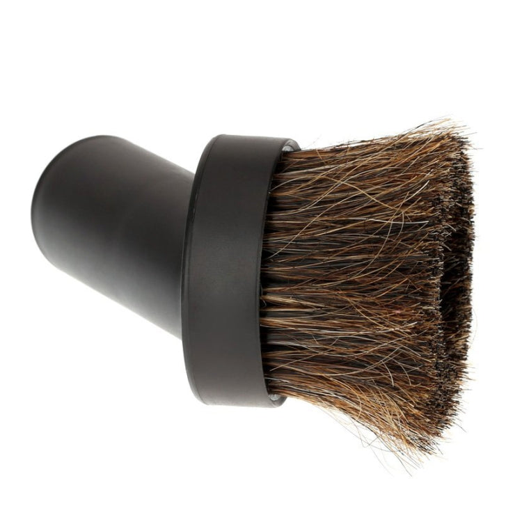 Vacuum cleaner brush head with wide horse-hair bristle face and black cylindrical body