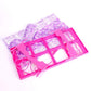 Mini pink plastic doll bed base with floral fabric panel and decorative scroll side panels