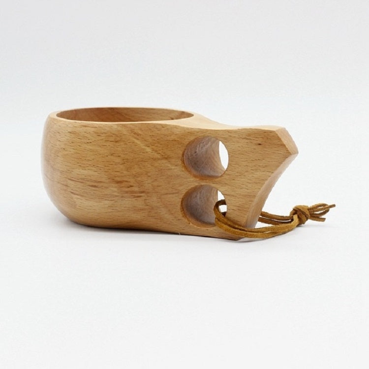 Handmade wooden cup with oval handle cutouts and brown cord ties