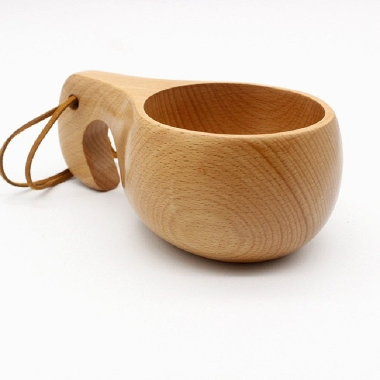 Wooden cup with rounded bowl, side hole, and braided cord strap