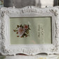 White ornate carved picture frame with raised floral border and rose bouquet insert
