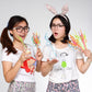 Curved plastic party straws in assorted colors held up in front view