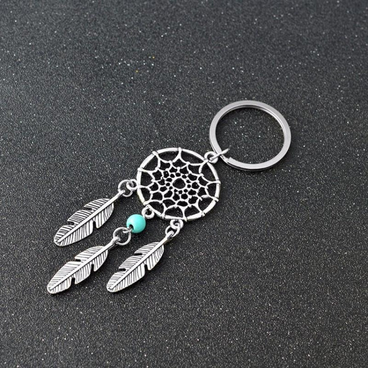 Silver dreamcatcher keychain with turquoise bead and three feather charms