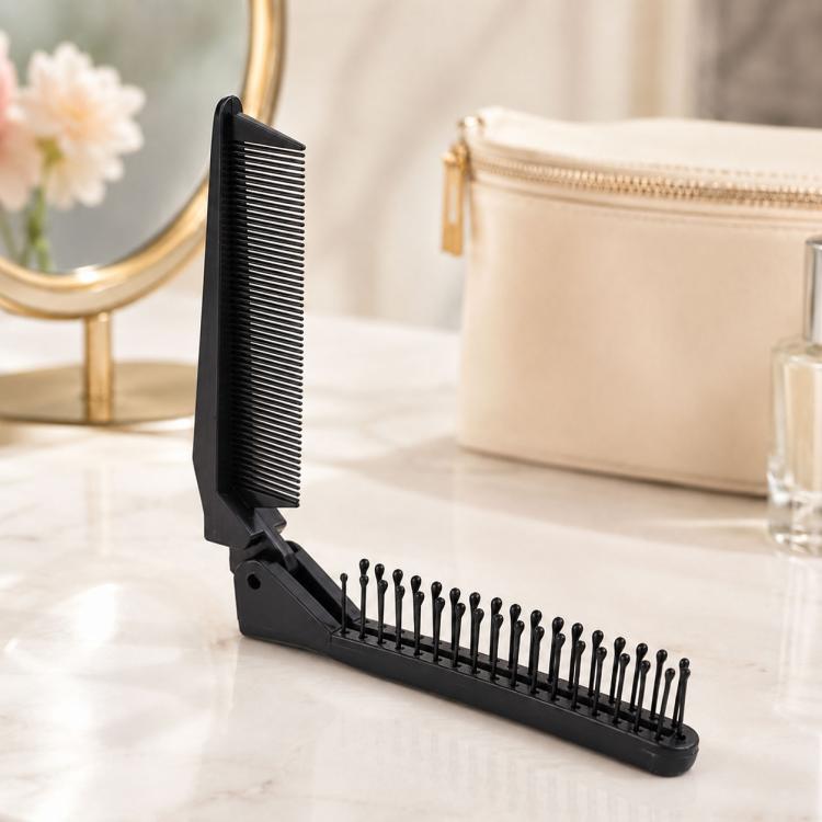 Black folding travel hair comb with fine teeth and massage pins