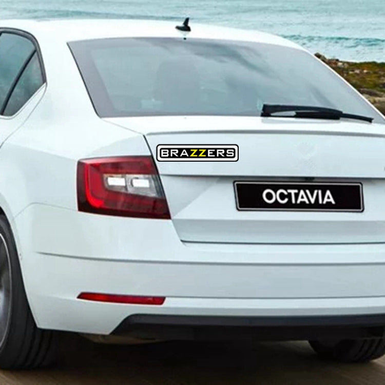 BRAZZERS logo car sticker on rear window of a white car