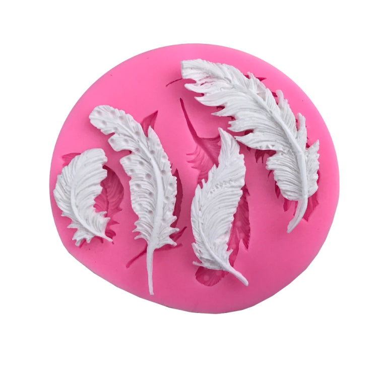 Pink round silicone mold with three large raised feather designs