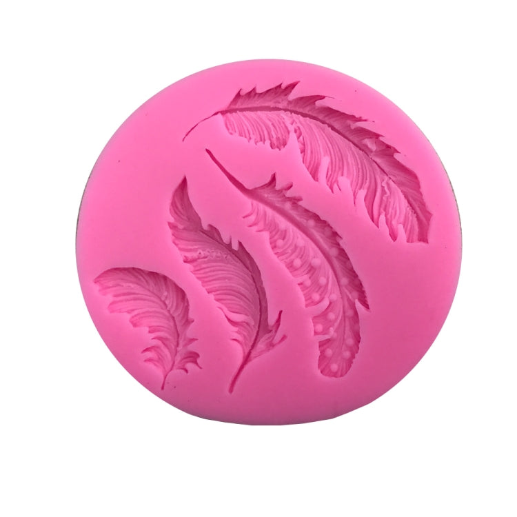 Pink silicone mold with detailed feather impressions for fondant or sugar