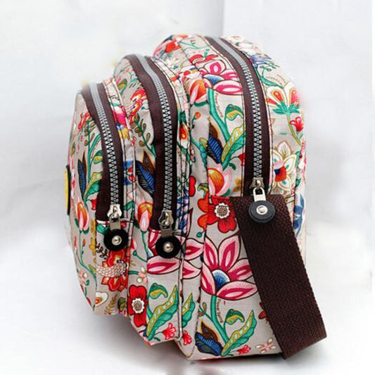 Women’s colorful bird-and-flower patterned waterproof nylon crossbody bag with brown strap