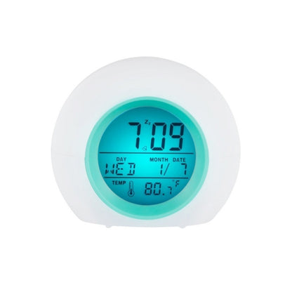 Round digital alarm clock with blue backlit screen, day month date and temp display