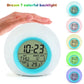 Round LED alarm clock with colorful backlight, time, day/date, and temperature readout