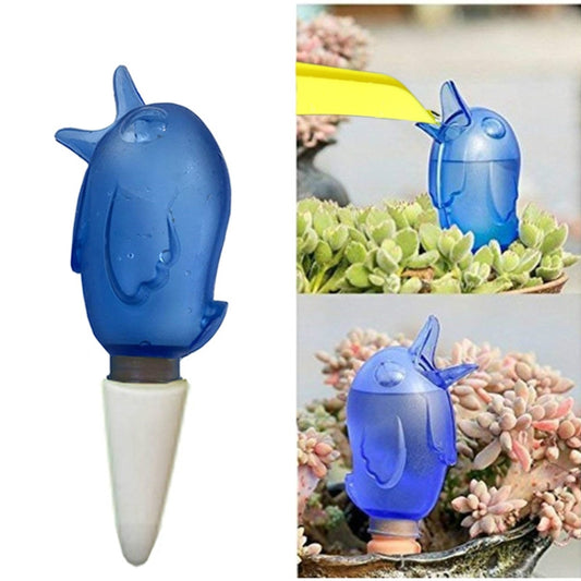 Blue bird-shaped garden sprinkler with clear nozzle and white ground stake