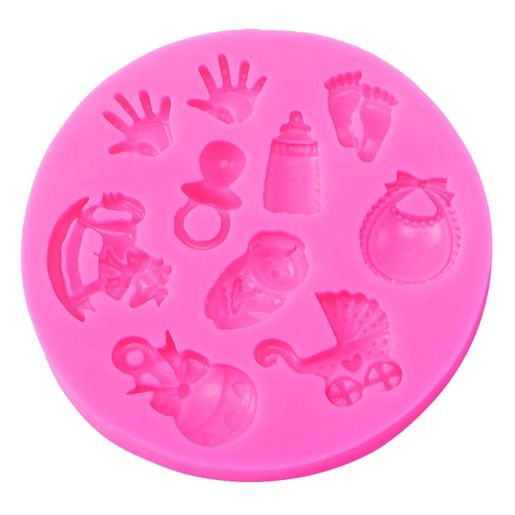 Pink silicone fondant mold with baby hand, foot, bottle and bib shapes