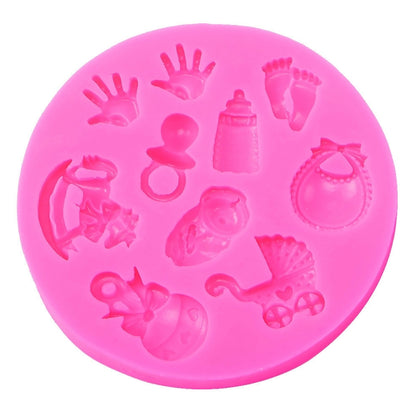 Pink silicone fondant mold with baby hand, foot, bottle and bib shapes
