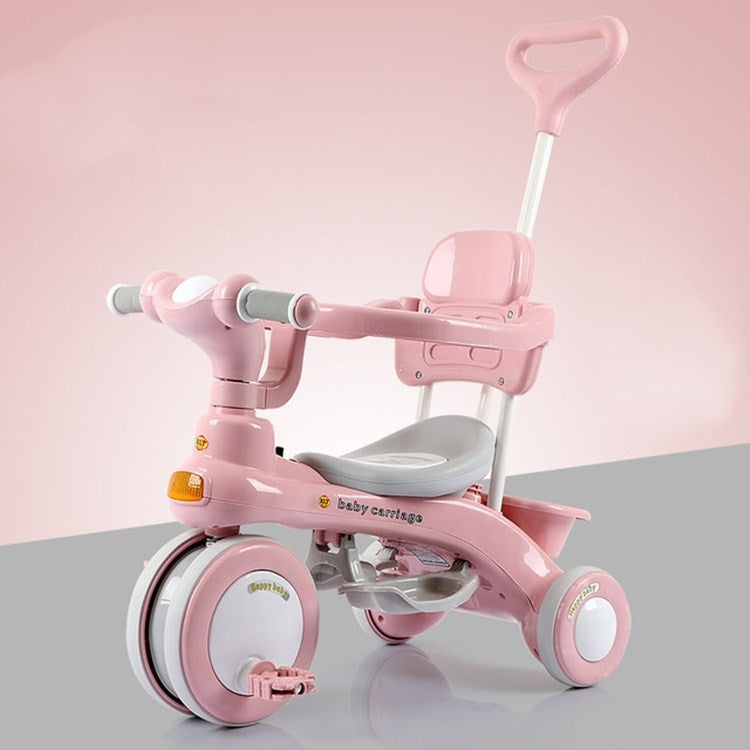 Pink kids tricycle stroller with seat, handlebar, and front storage tray