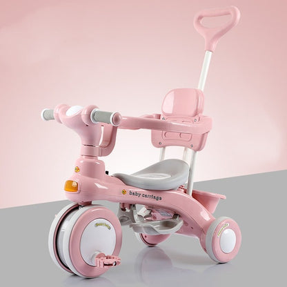 Pink kids tricycle stroller with seat, handlebar, and front storage tray