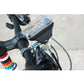 Mechanical odometer mounted on handlebar with clear housing and speed sensor cable