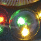 Illuminated hemisphere fountain nozzle spray dome with central outlet