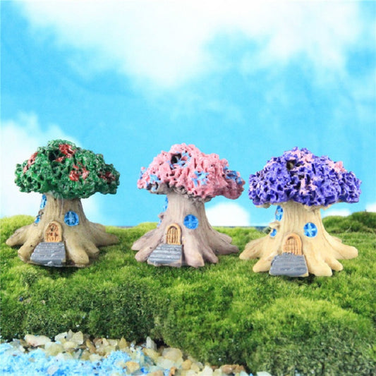 Set of three resin tree decorations on grass: green, pink, and purple canopies