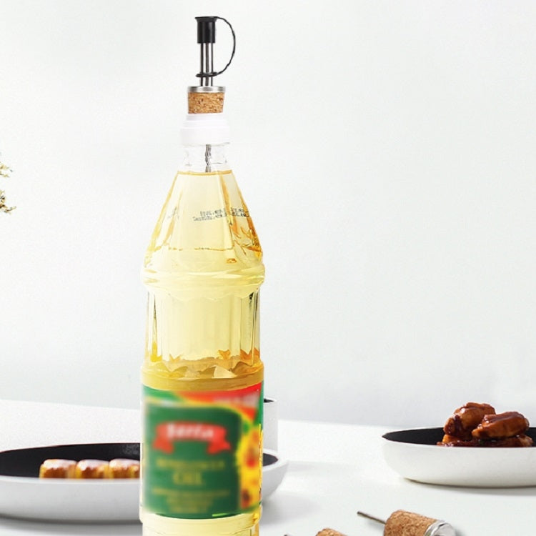 Wine bottle with cork stopper wine diversion spout dispenser in place