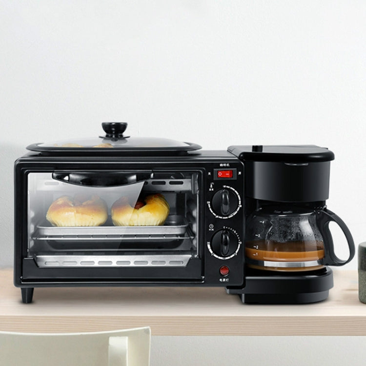 Black mini oven with two bread rolls inside, plus attached coffee maker module