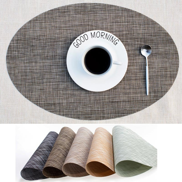 Oval placemat in grey fabric with cup and spoon on it; assorted color options shown below
