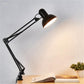 Black swing arm table lamp with angled round shade
