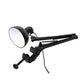 Black clamp mount swing arm lamp with round shade and power cord