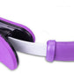 Close-up of purple Pilates ring foam pad with black spring resistance bar