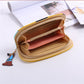 Long zipper wallet clutch open to show interior card holders and striped divider
