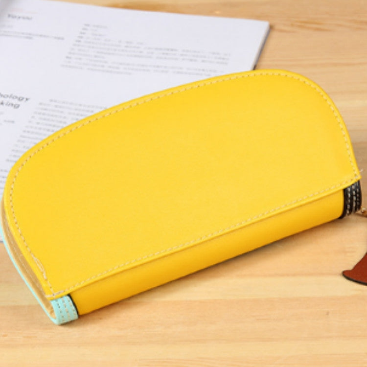 Yellow long zipper wallet clutch with smooth front panel and black stitched side trim