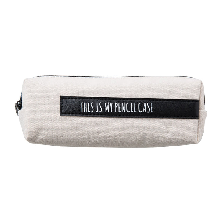 Cream pencil case with black front label and zipper, rectangular shape