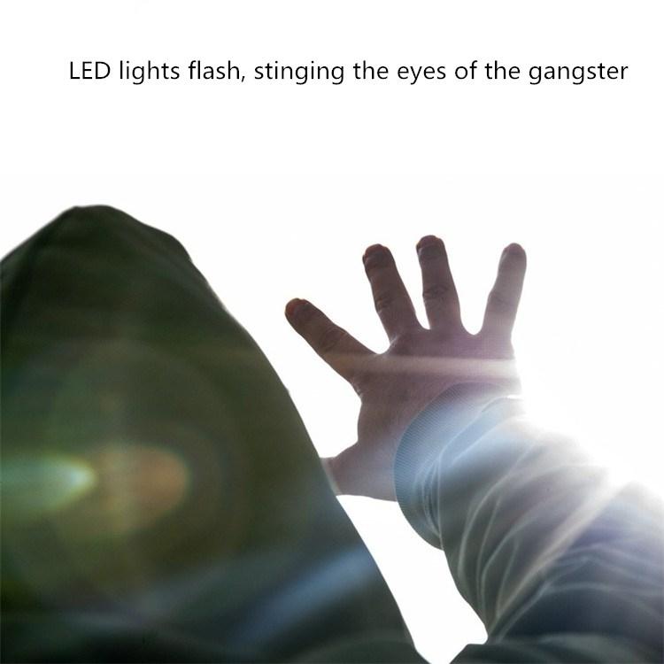 Portable personal alarm flashlight beaming LED light from SOS keychain