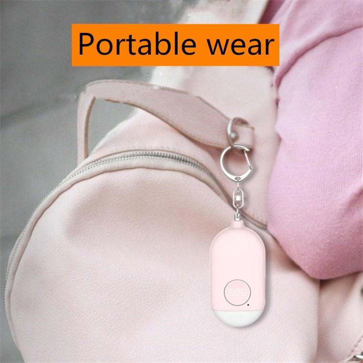 Pink keychain personal alarm flashlight clipped to bag strap