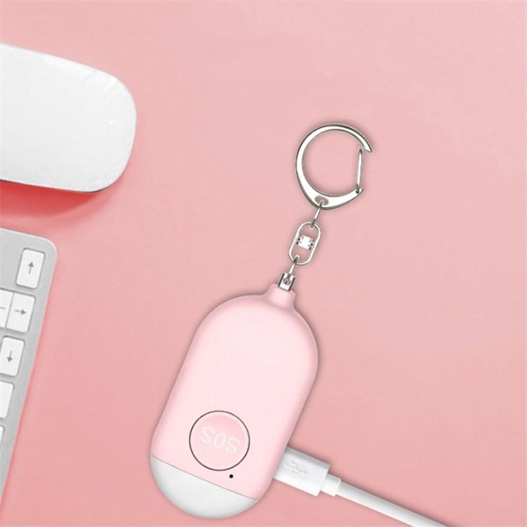 Pink personal safety alarm keychain with circular SOS button and metal clip