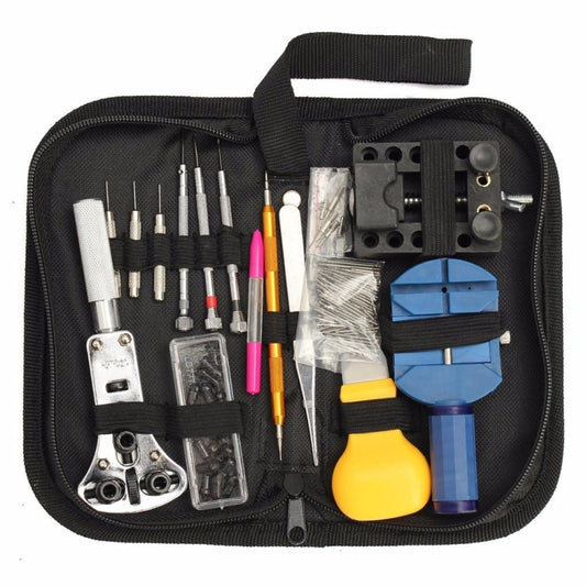 Black watch repair tool pouch with metal bits, screwdrivers, tweezers, and blue tools
