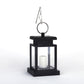 Black lantern-style LED candle light with hanging metal ring handle and frosted candle
