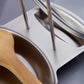Stainless steel drainer tray corner with upright legs and curved draining surface