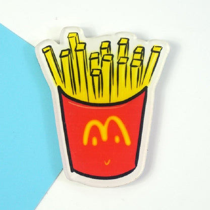 Cartoon French fries refrigerator magnet in red and yellow takeout cup