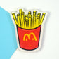 Cartoon French fries refrigerator magnet, red container with yellow fries graphic