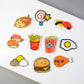 Cartoon food refrigerator magnet set with fries, burger, sushi, taco, and egg