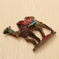 Camel refrigerator magnet lying on its side, showing 'SYRIA' text on base