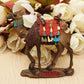 Dressed camel refrigerator magnet with colorful tack and 'SYRIA' label on base