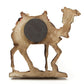 Camel refrigerator magnet silhouette with dark circular detail and light wood base