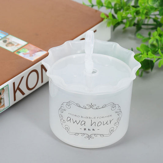 White facial cleaner frother bottle with foam cup and vertical pump