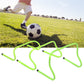 Football training hurdle on grass with neon green frame and black end caps